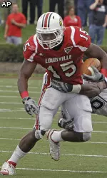 Bilal Powell tries to get away from Connecticut's Sio Moore during first half action.