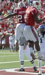 Victor Anderson (20), right, and Josh Bellamy (1) meet mid-air after Bellamy's touchdown against Memphis. (AP Photo/Brian Bohannon)