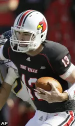 Louisville quarterback Justin Burke scrambles for yardage.