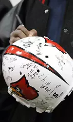 Fan gets his helmet signed