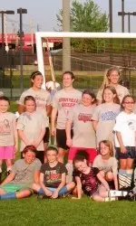 Louisville players with some of the athletes at the free clinics.