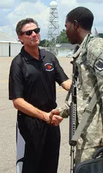 U of L Coach Rick Pitino (above left) greeted troops returning from Iraq on July 14.