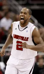 Louisville's Preston Knowles yells out after hitting a shot during the first half.