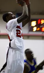 Russ Smith drives to the basket for two of his team-high 22 points against the Real Deal Shockers.