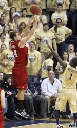 Louisville's Kyle Kuric hits a 3-point shot.