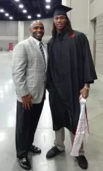 Football head coach Charlie Strong and wide receiver Andrell Smith on graduation day.