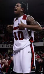 Edgar Sosa celebrates after hitting a game-winning three with 2.8 seconds left against Kentucky in 2009