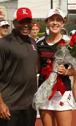 Coach Mark Beckham and Sarah Miller at the Senior Day Ceremony.