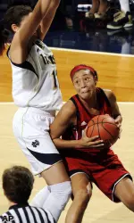 Anotinta Slaughter looks to shoot over Notre Dame forward Natalie Achonwa.