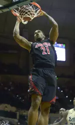 Chane Behanan dunks in front of South Florida's Kore White.