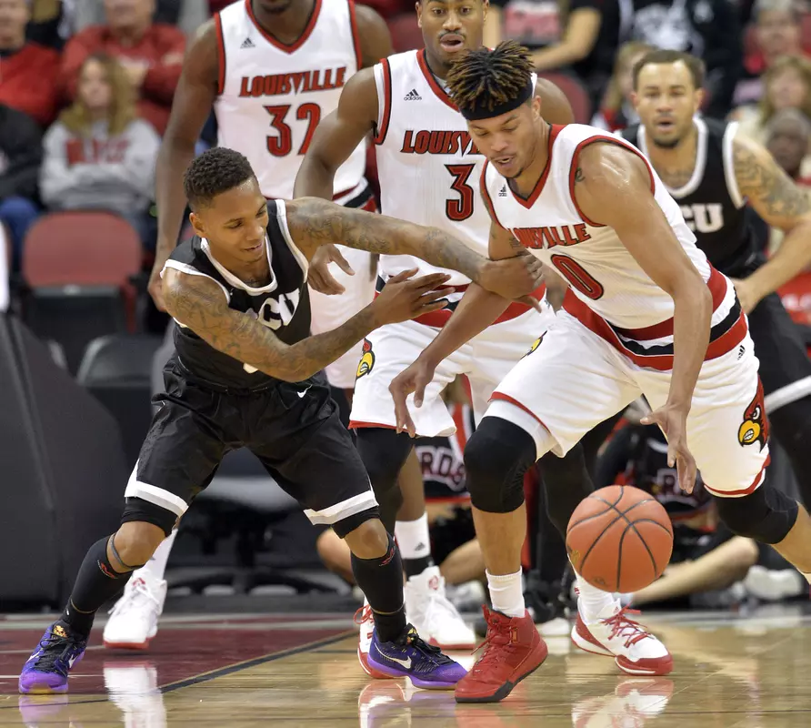 Louisville's Damion Lee (0) battles with Grand Canyon's DeWayne Russell (0) for a loose ball during the first half of an NCAA college basketball game, Saturday, Dec. 5, 2015, in Louisville, Ky. (AP Photo/Timothy D. Easley)