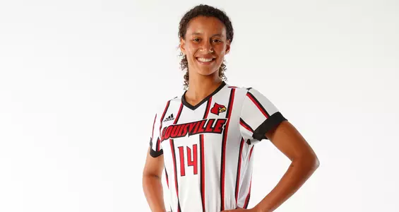 Gabrielle Vincent smiles for the camera at a team photo shoot