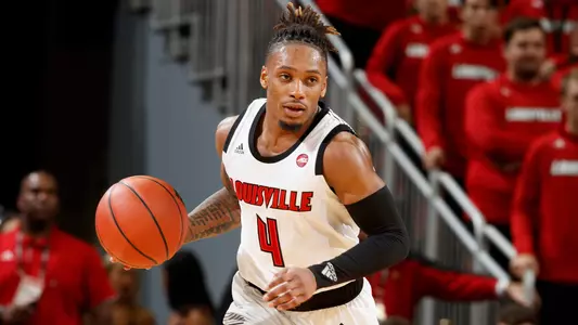 Khwan Fore brings the ball up court during the Cardinals Red & White scrimmage at KFC YUM! Center on October 21.