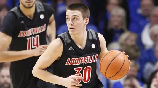 Ryan McMahon handles the ball wearing his road black uniform in game action during the 2017-18 season.