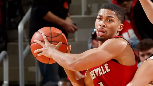 Christen Cunningham is covered by Ryan McMahon during the Cardinals Red & White scrimmage at KFC YUM! Center on October 21.