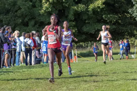 Dorcas Wasike lengthens her lead in the Louisville Classic Cross Country Meet