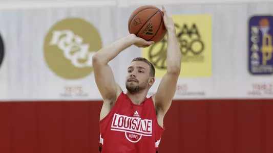 Will Rainey puts up a shot at a practice session in the campus Yum! Center practice facility.