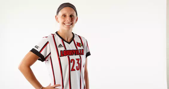 Allison Whitfield smiles for the camera during a team photo shoot