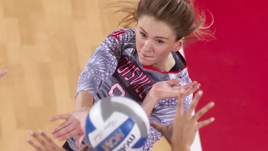 Claire Chaussee hits the ball during the Cardinals volleyball game.