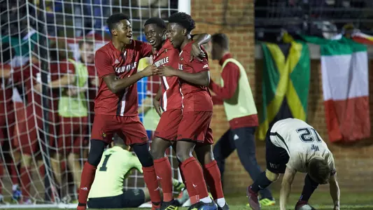 his teammates after scoring a golden goal in overtime against the Wake Forest Demon Deacons at W. Dennie Spry Soccer Stadium on November 7, 2018 in Winston-Salem, North Carolina. The Cardinals defeated the Demon Deacons 2-1 in overtime. (Brian Westerholt/Sports On Film)