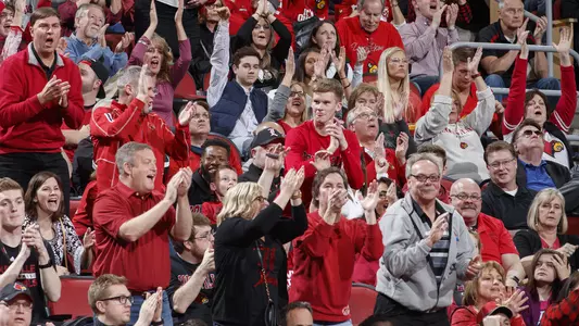 Fans cheer in the stands of the KFC Yum! Center at a home game in the 2017-18 season