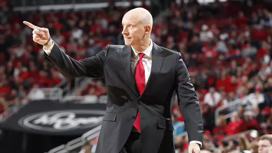 UofL Coach Chris Mack points to one of his players on the court during the Cardinals' season-opening game vs. Nicholls.