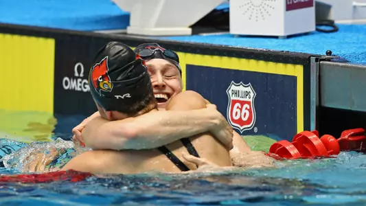 Kelsi Dahlia and Mallory Comerford celebrate at Phillips 66 National Championships.