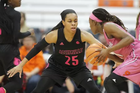 Louisville's Asia Durr, left, covers Syracuse's Gabrielle Cooper, right, in the first quarter of an NCAA college basketball game in Syracuse, N.Y., Sunday, Feb. 4, 2018. (AP Photo/Nick Lisi)