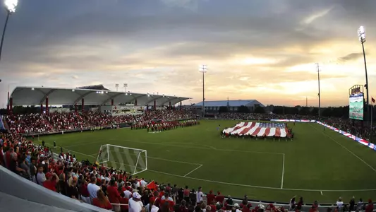 Overhead view of pregame ceremony for a men's soccer match at Dr. Mark and Cindy Lynn Stadium.