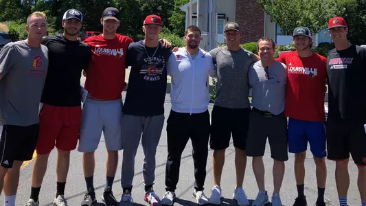 Head coach Dan McDonnell with eight Cardinals on Cape Cod during their summer baseball season.