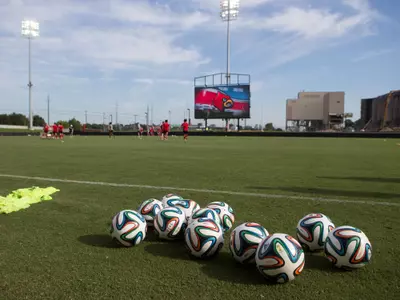 Soccer balls on the sideline during a morning practice at Lynn Stadium, August 15, 2014. | Louisville Women's Soccer Practice | Photo by : Michelle Hutchins | Louisville Athletics