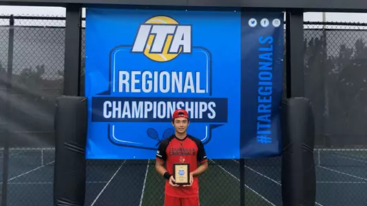 Tin Chen poses with his ITA/Ohio Valley Regional championship award