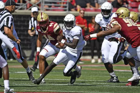 CORRECTS FIRST NAME TO MICALE, NOT MALIK - Louisville quarterback Micale Cunningham (3) runs through an opening in the Boston College defense during the first half of an NCAA college football game in Louisville, Ky., Saturday, Oct. 5, 2019. (AP Photo/Timothy D. Easley)