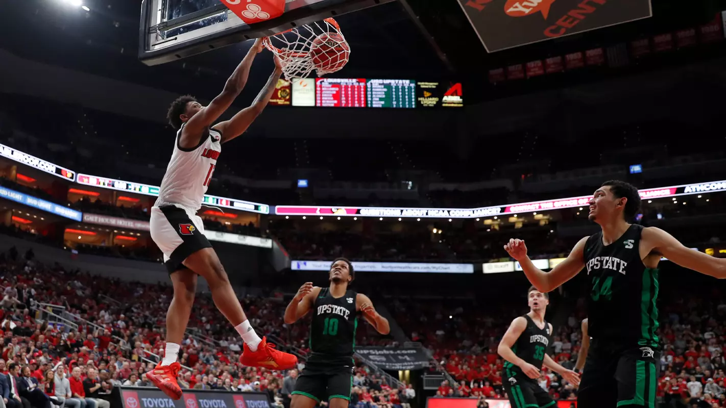 David Johnson dunks for his first career basket against USC Upstate.