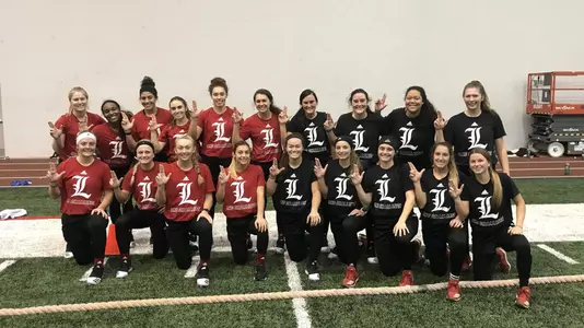 The softball poses for a photo at the Trager Indoor Center