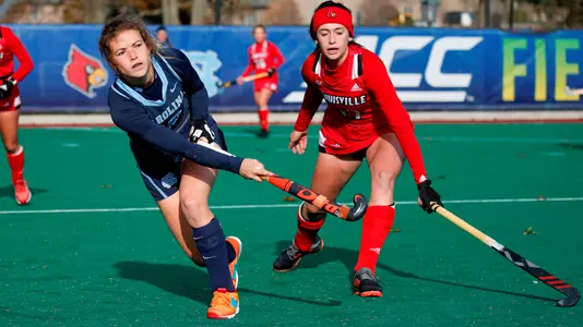 North Carolina's Yentl Leemans clears the ball ahead of Louisville's Whena Munn during the second half of a semifinal in the 2019 ACC Field Hockey Championship at the Newton Campus Sports Complex in Newton, Mass., Friday, Nov. 8, 2019. (Photo by Mary Schwalm, the ACC)