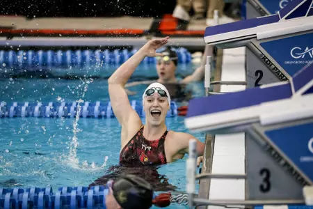 Lainey Visscher celebrates at the touchpads.