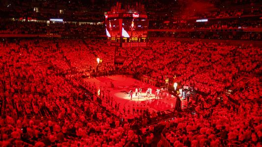 The KFC Yum! Center is aglow with red lights during pregame player introductions.