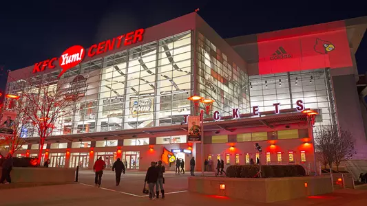 The front of the KFC Yum! Center was lit with red accents.