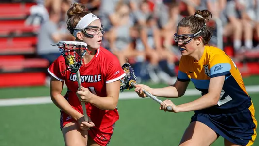 Ally Hall advances the ball during Louisville's scrimmage with Marquette.
