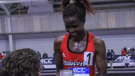 Dorcas Wasike is honored on the medal stand at the ACC Indoor Championships