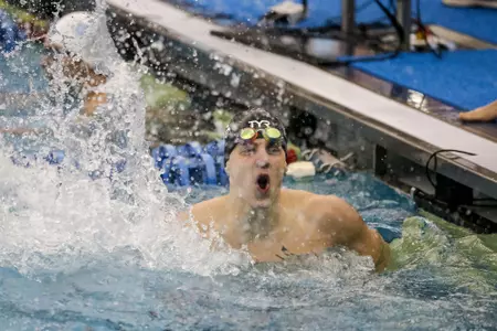 Mitchell Whyte splashes in celebration of his race finish.