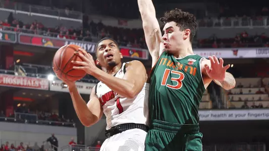 Christen Cunningham drives against Miami in the KFC Yum! Center in January.