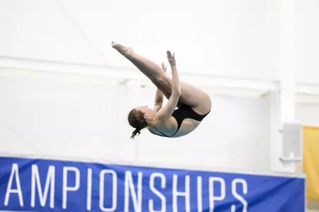 Molly Fears does a somersault in the pike position.