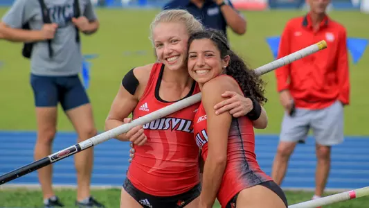Morgan Zacharias and Gabriela Leon celebrate after breaking the school recod