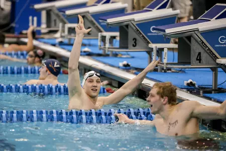Bartosz Piszczorowicz celebrates after winning gold in the 200 free at the ACC Championships.