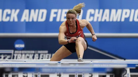 Holly Hankenson competes in the hurdles at the NCAA Championships