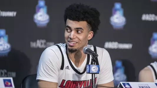 Jordan Nwora answers questions from the dias at the 2019 ACC Tournament in Charlotte, N.C.