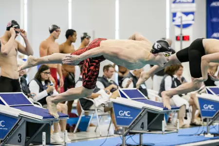 Andrej Barna jumps off the blocks for the 50 free at ACCs.