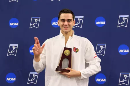 Nick Albiero stands on the podium at the NCAA Championships.